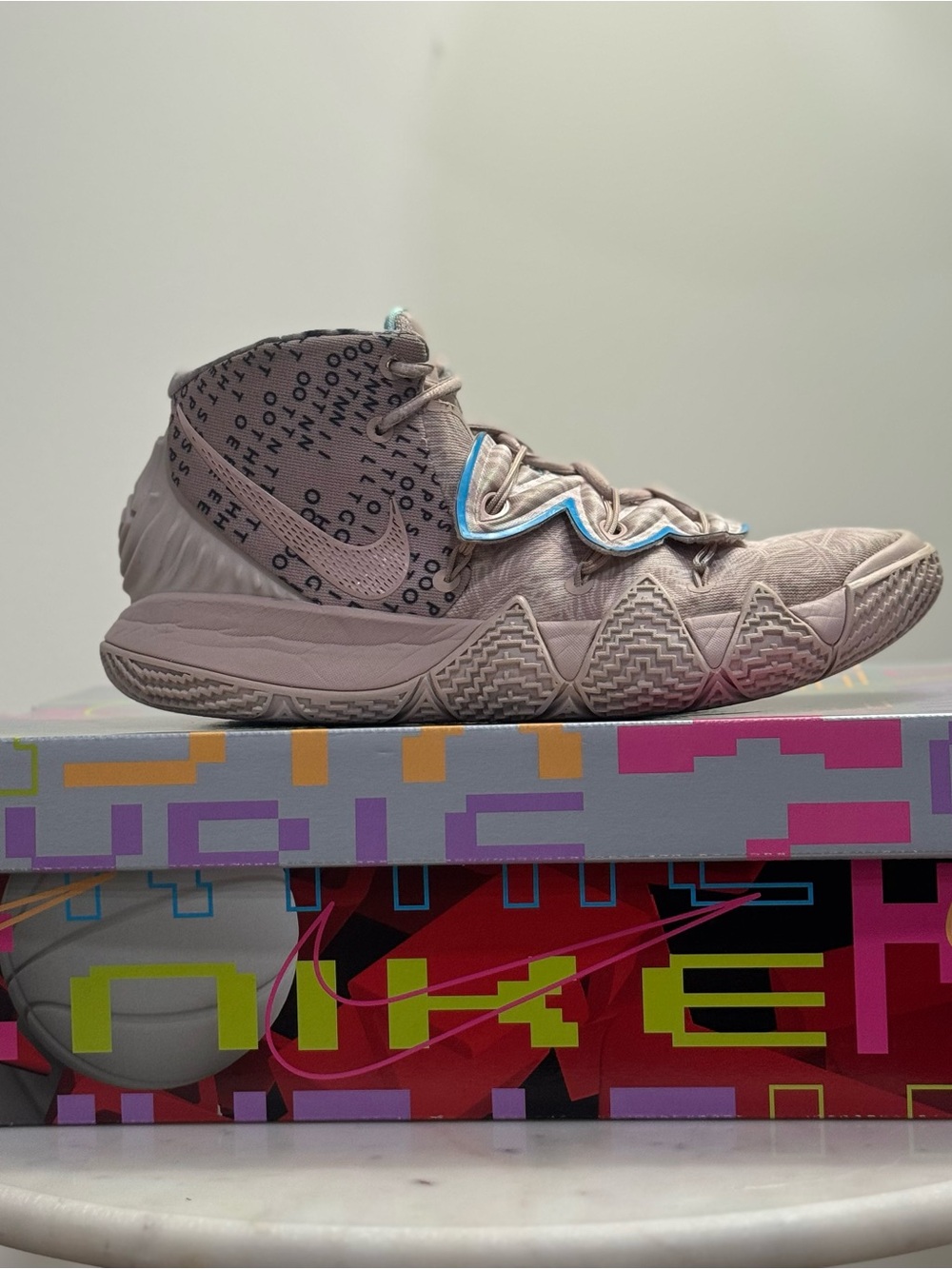 Nike Kyrie Mid-Top Basketball Shoe in Light Taupe with Aqua Trim